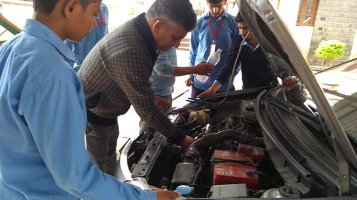 Repairing car during the practical of   MMV Trade